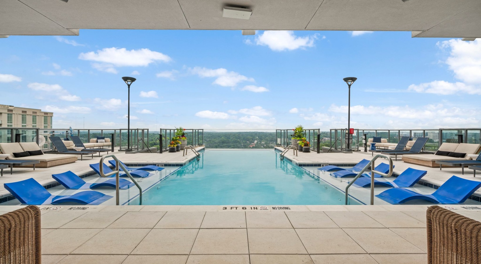 Rooftop Infinity Pool with Lounge Seating