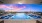 Rooftop Infinity Pool with Lounge Seating at Sunset