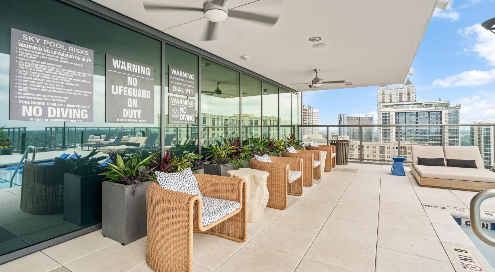 Rooftop Infinity Pool with Lounge Seating